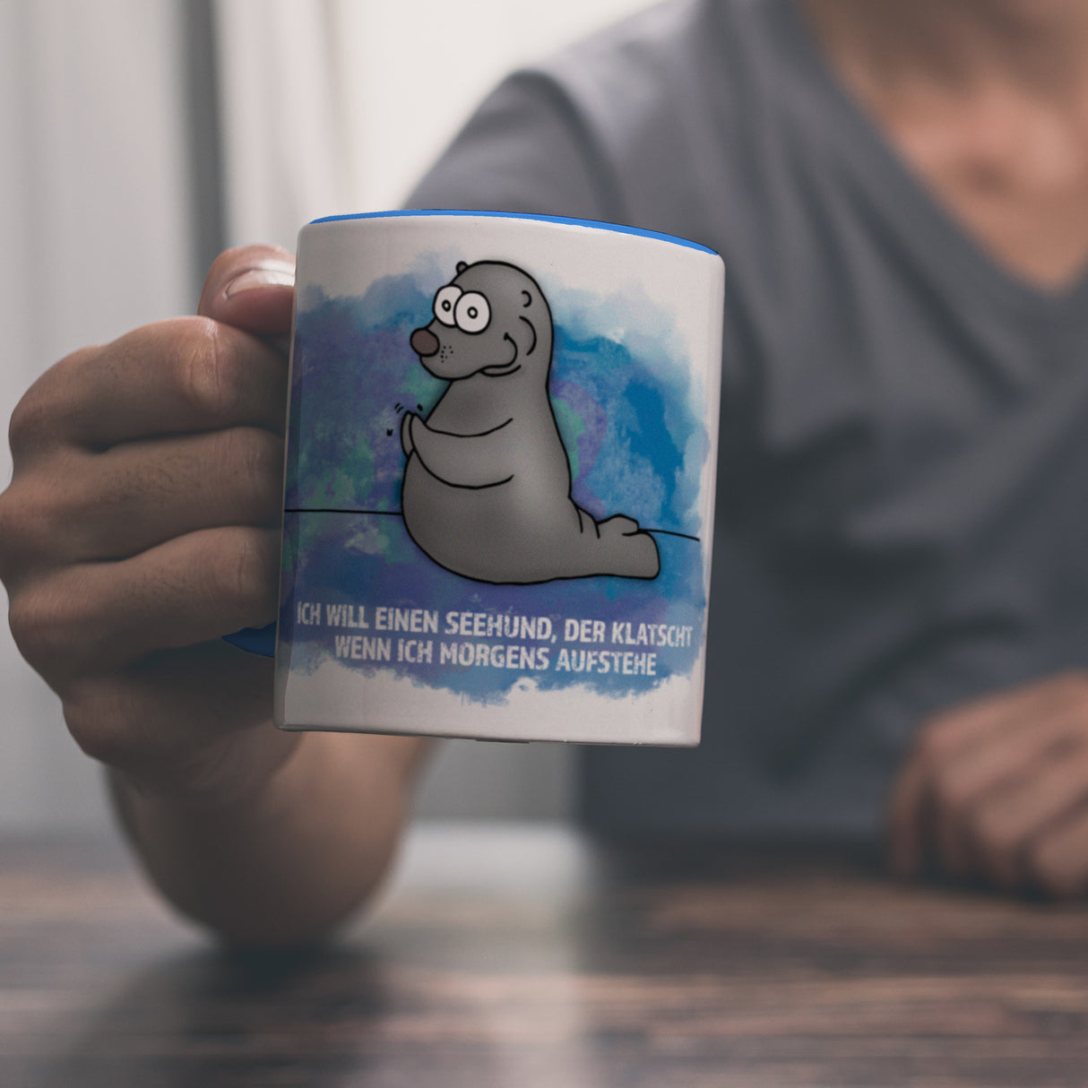 Kaffeebecher mit Seehund Motiv und Spruch: Ich will einen Seehund, der klatscht, ...