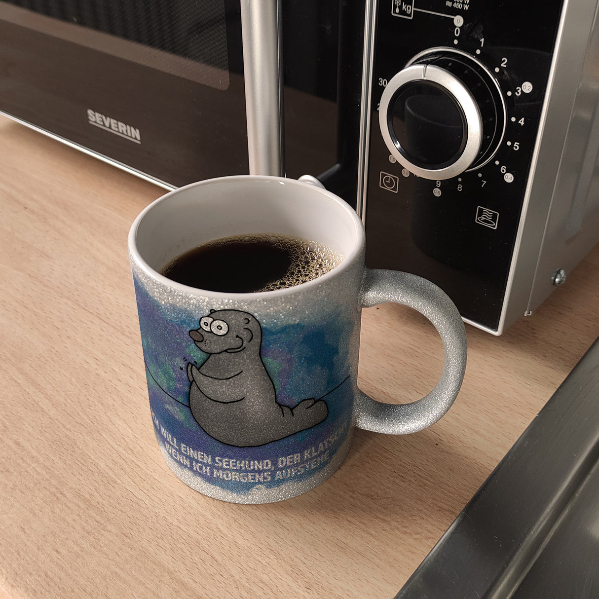Kaffeebecher mit Seehund Motiv und Spruch: Ich will einen Seehund, der klatscht, ...