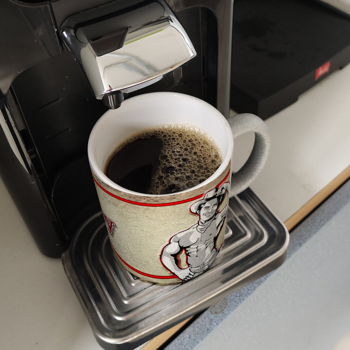 Kaffeebecher mit sexy Cowboy und Spruch - Ich will 'nen Cowboy als Mann