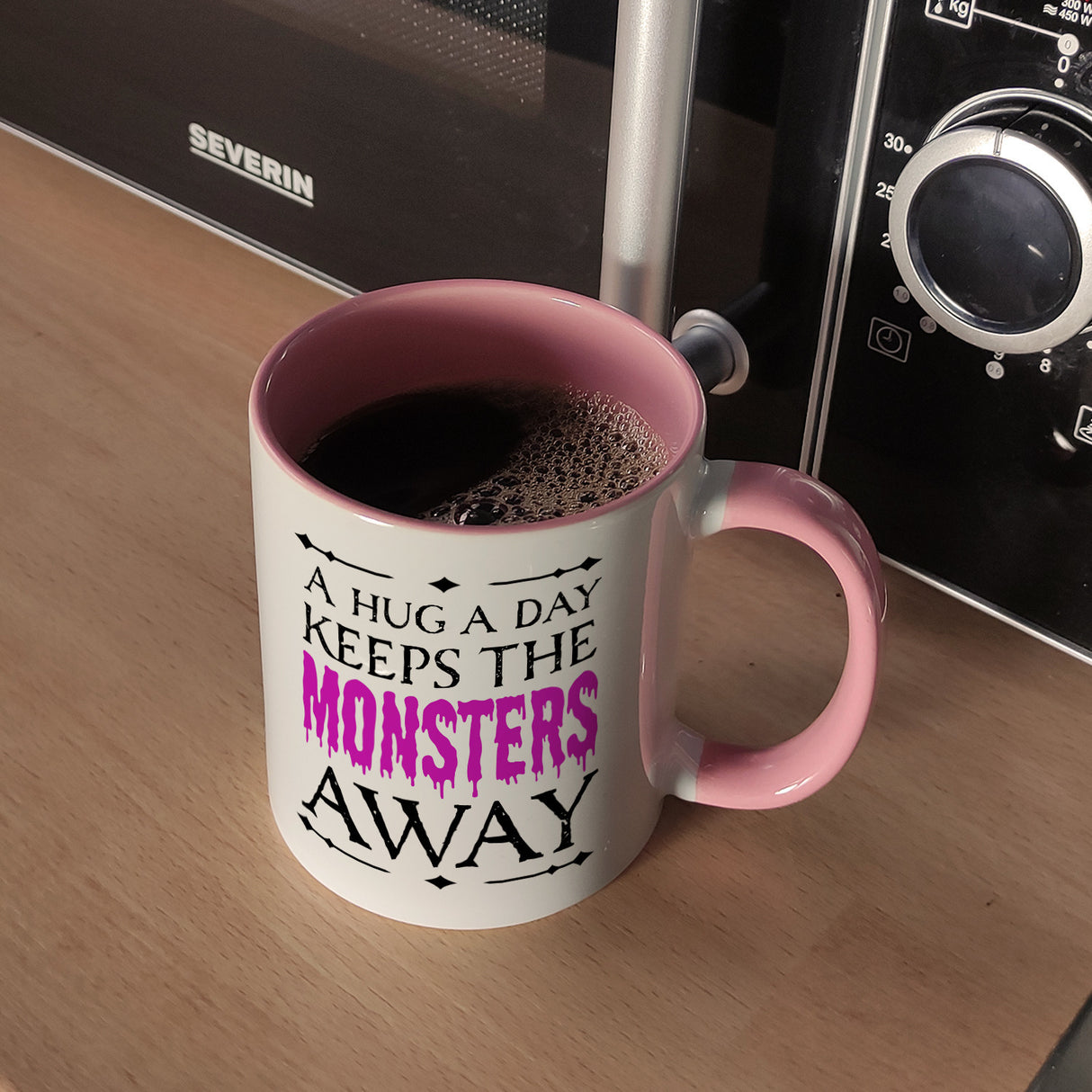 Kaffeetasse für Halloween mit Spruch - A hug a day keeps the monsters away