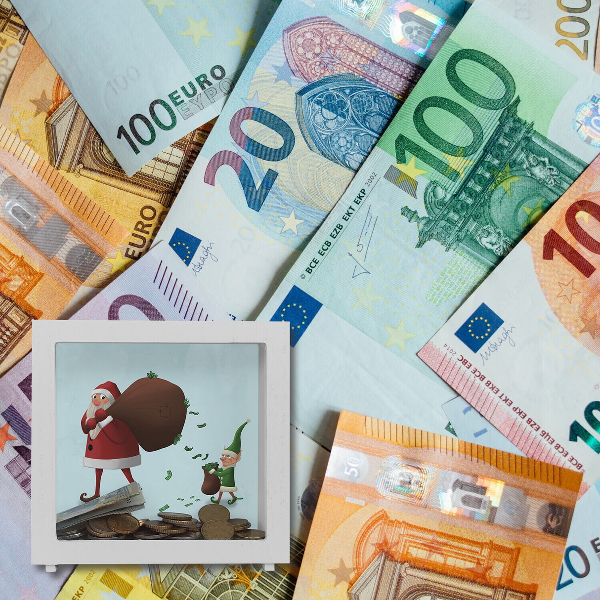 Weihnachtsmann mit einem Sack voll Geld und Weihnachtself Spardose