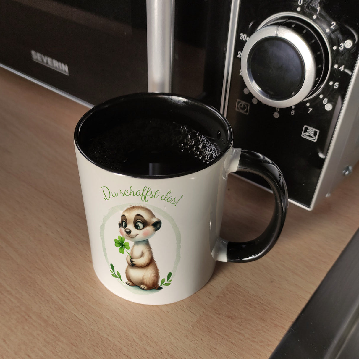 Erdmännchen mit Kleeblatt Kaffeebecher mit Spruch Du schaffst das
