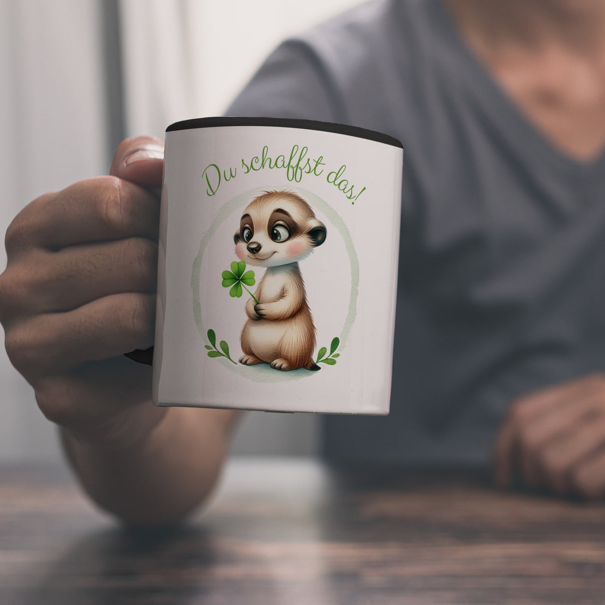 Erdmännchen mit Kleeblatt Kaffeebecher mit Spruch Du schaffst das