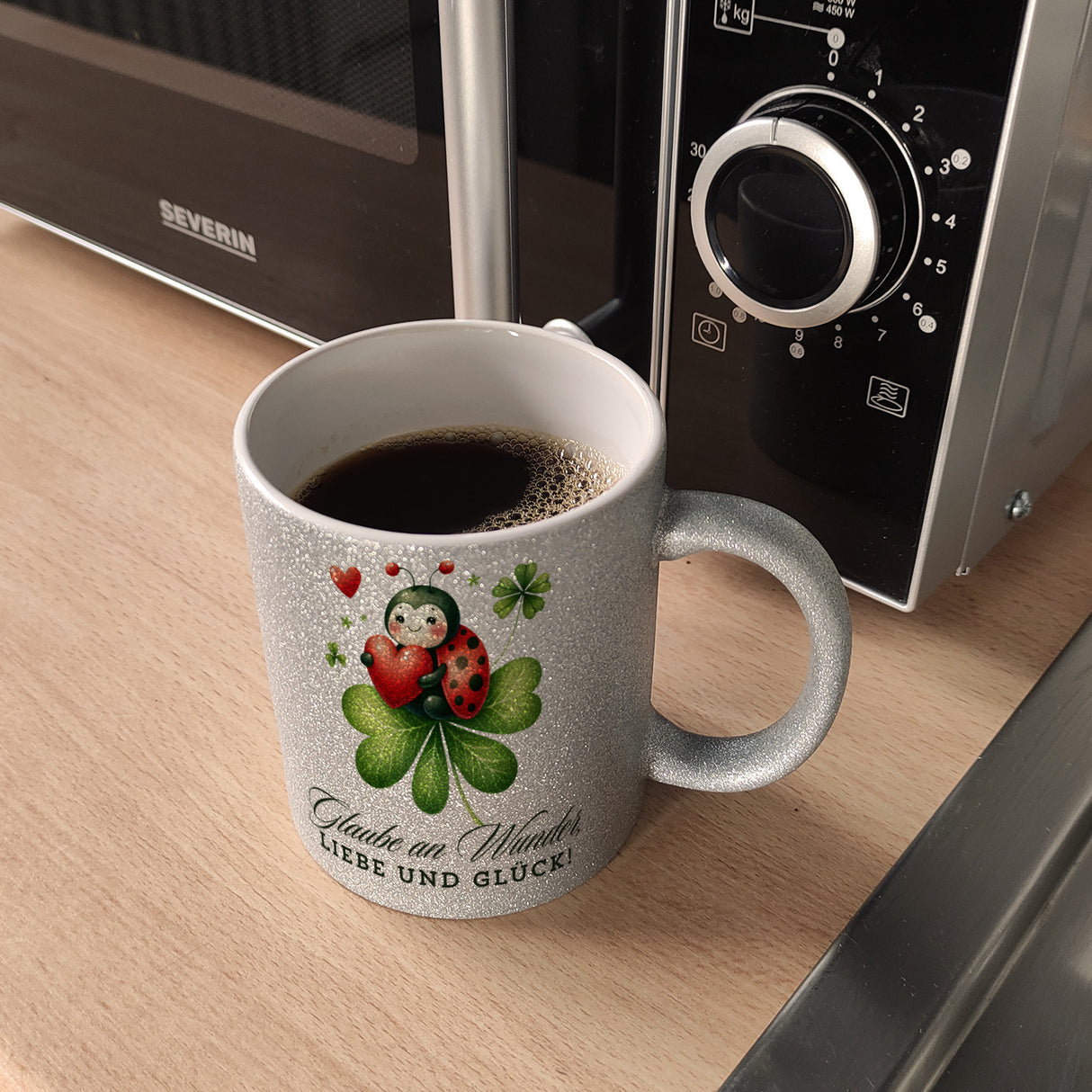 Marienkäfer Kaffeebecher mit Spruch Glaube an Wunder, Liebe und Glück!