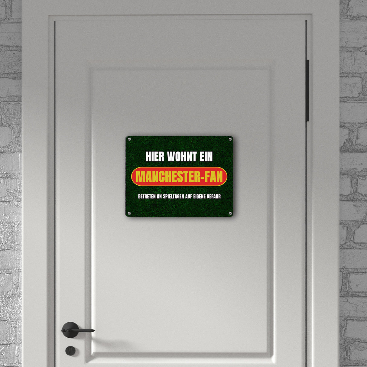 Hier wohnt ein Manchester-Fan Metallschild in 15x20 cm mit Rasenmotiv