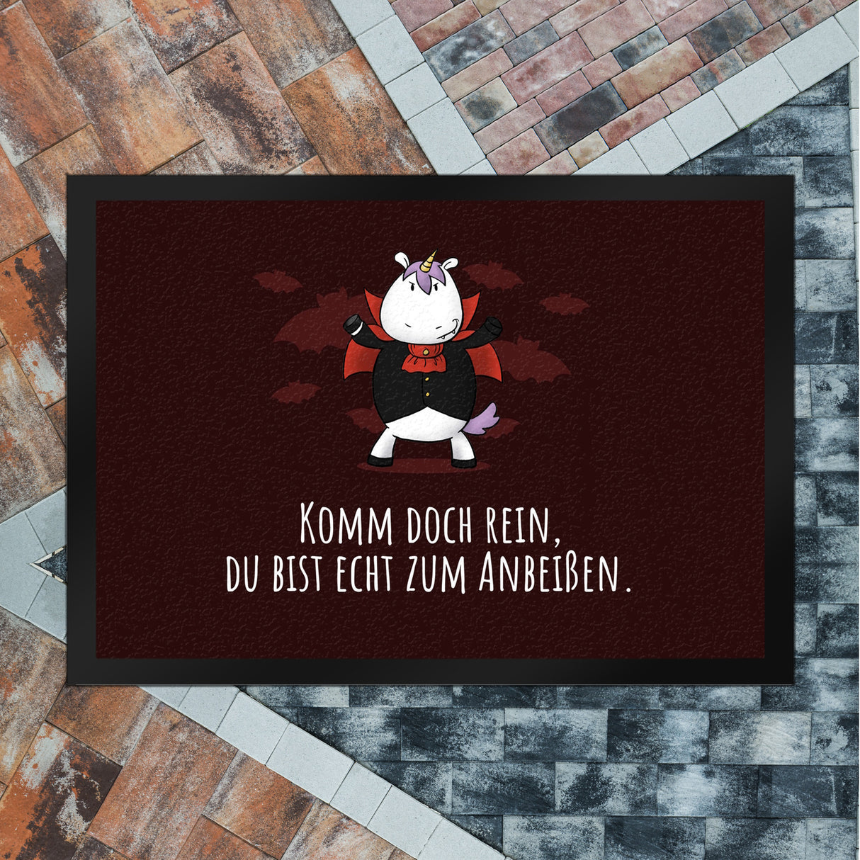 Einhorn-Vampir Fußmatte in 35x50 cm mit Spruch Du bist echt zum Anbeißen