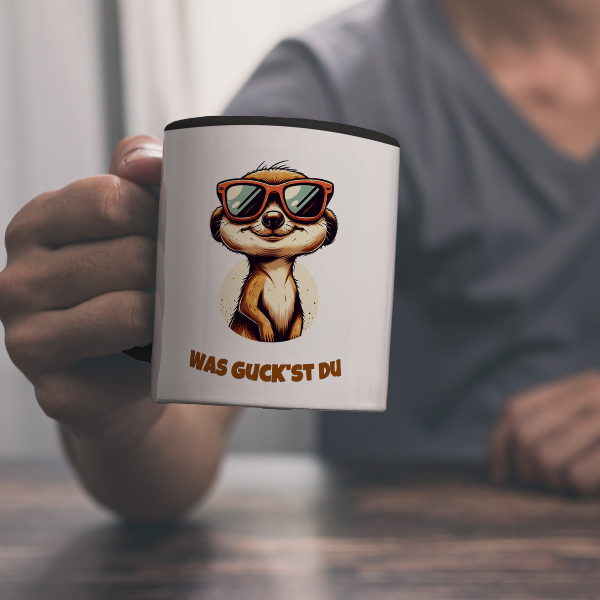 Erdmännchen Geschenke Kaffeebecher mit Spruch Was guckst du