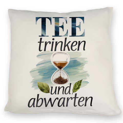 Sanduhr mit Teeblättern Kissen Tee trinken und abwarten