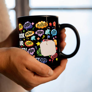 Comic Tasse in Schwarz mit Spruch: Comic sounds, coffee enthusiasts unite!
