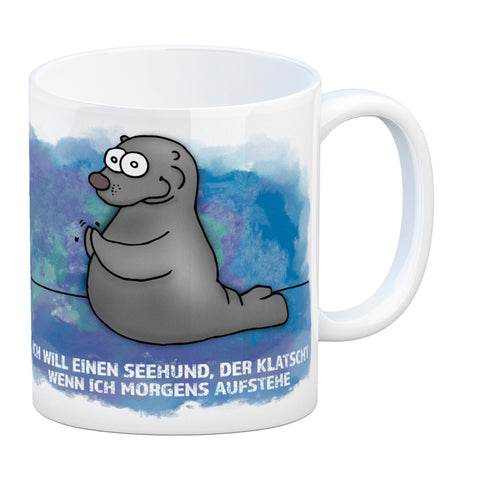 Kaffeebecher mit Seehund Motiv und Spruch: Ich will einen Seehund, der klatscht, ...