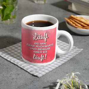 Kaffeebecher mit Spruch: Läuft bei mir. Zwar rückwärts ...