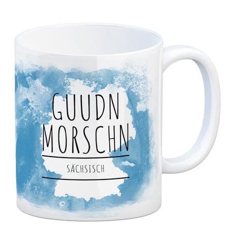 Hallo auf Sächsisch Guudn Morschen lustiger Kaffeebecher mit blauem Hintergrund