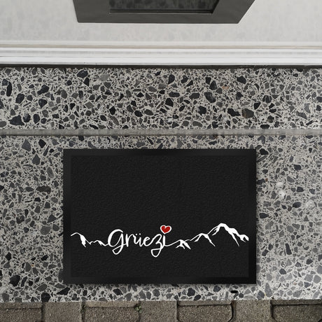 Fußmatte mit Grüezi-Schriftzug Herz und Bergen