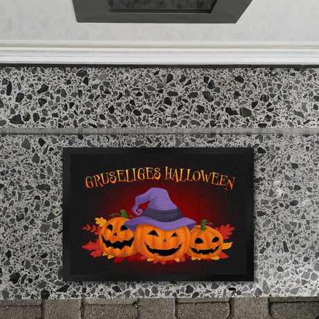 Gruseliges Halloween Fußmatte mit hübschen Kürbissen