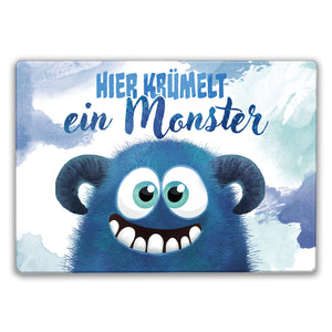 Süßes Monster in blau Schneidebrett aus Glas mit Spruch Hier krümelt ein Monster