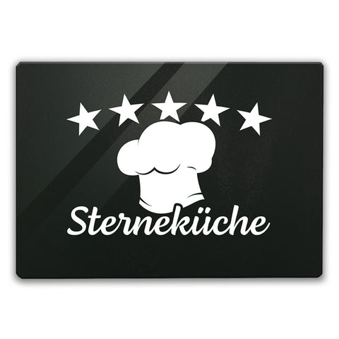Sterneküche Schneidebrett aus Glas mit Kochmütze und Sternen